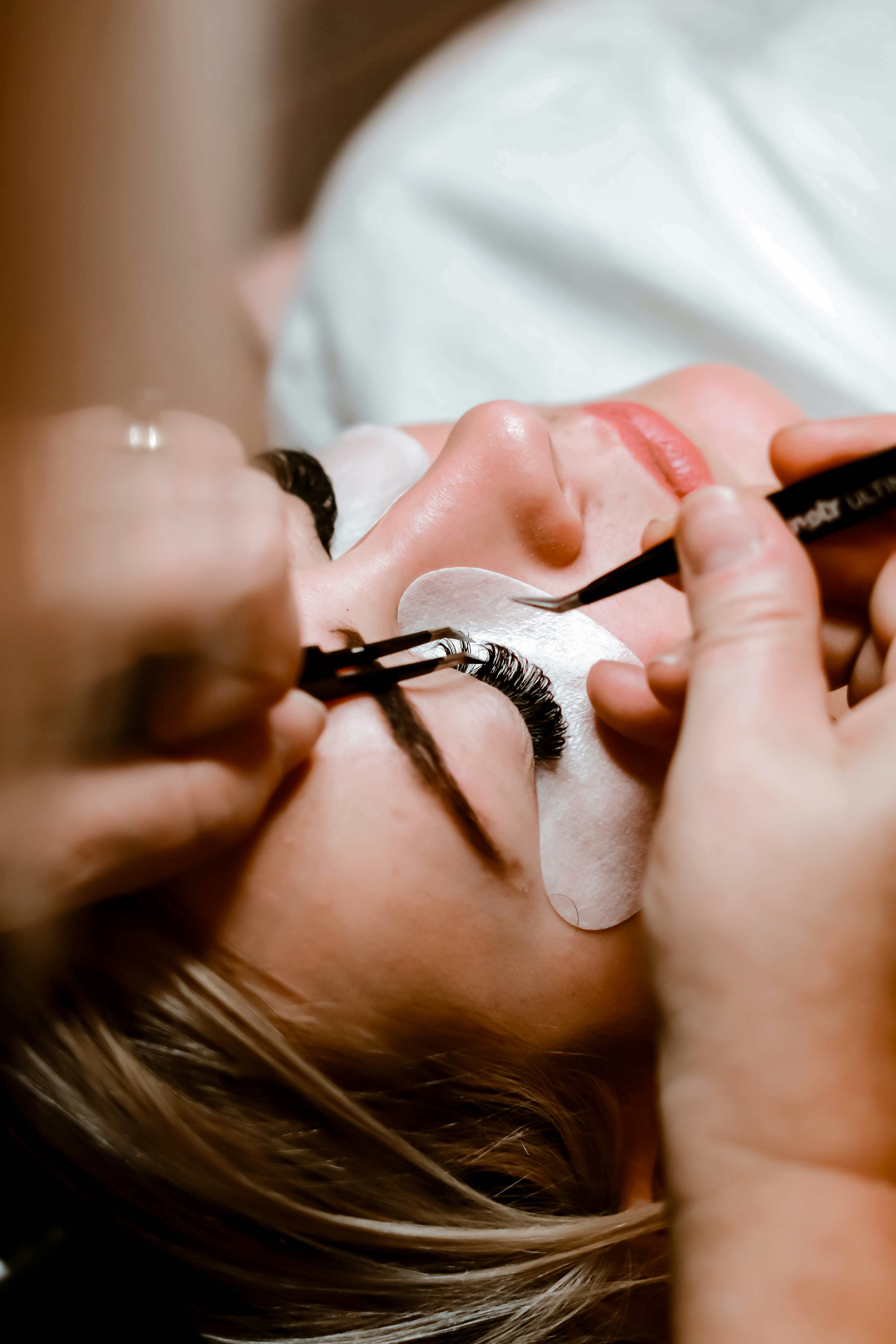 Eyelash treatment being applied